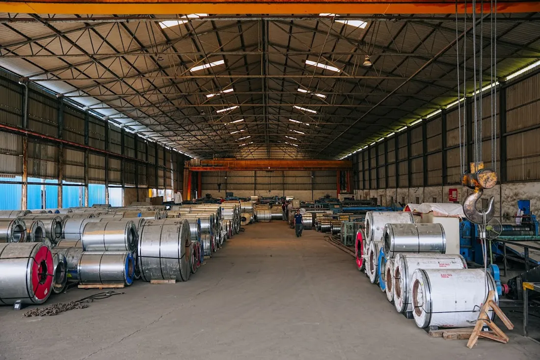 HST Steels factory floor with steel coils and processing lines